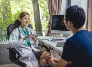 asian young doctor discussing diagnosis with patient about his health