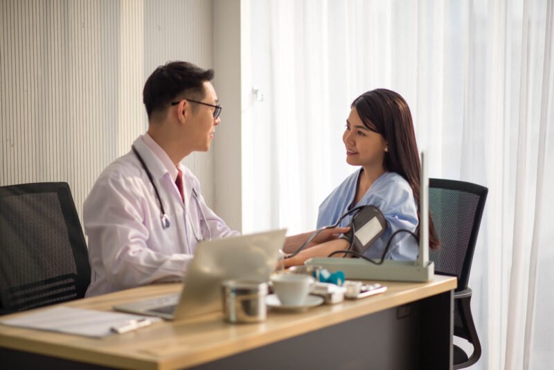 Asian Doctor and patient health care medical check sickness at hospital