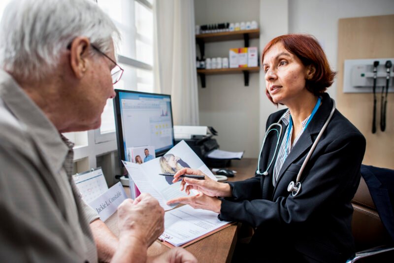 An elderly patient meeting doctor at the hospital