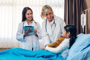 female doctors talking with little patient