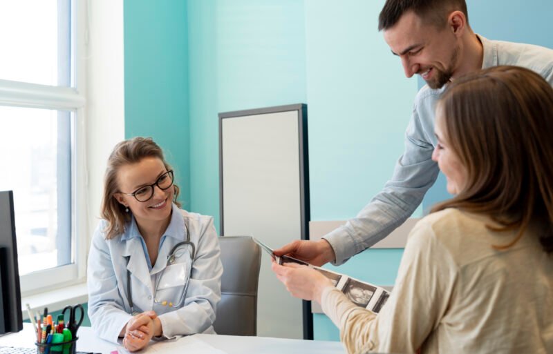 gynecologist-evaluating-pregnancy-with-patient