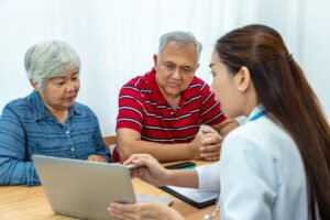 medical doctor explaining unhappy result senior elder patient couple man woman