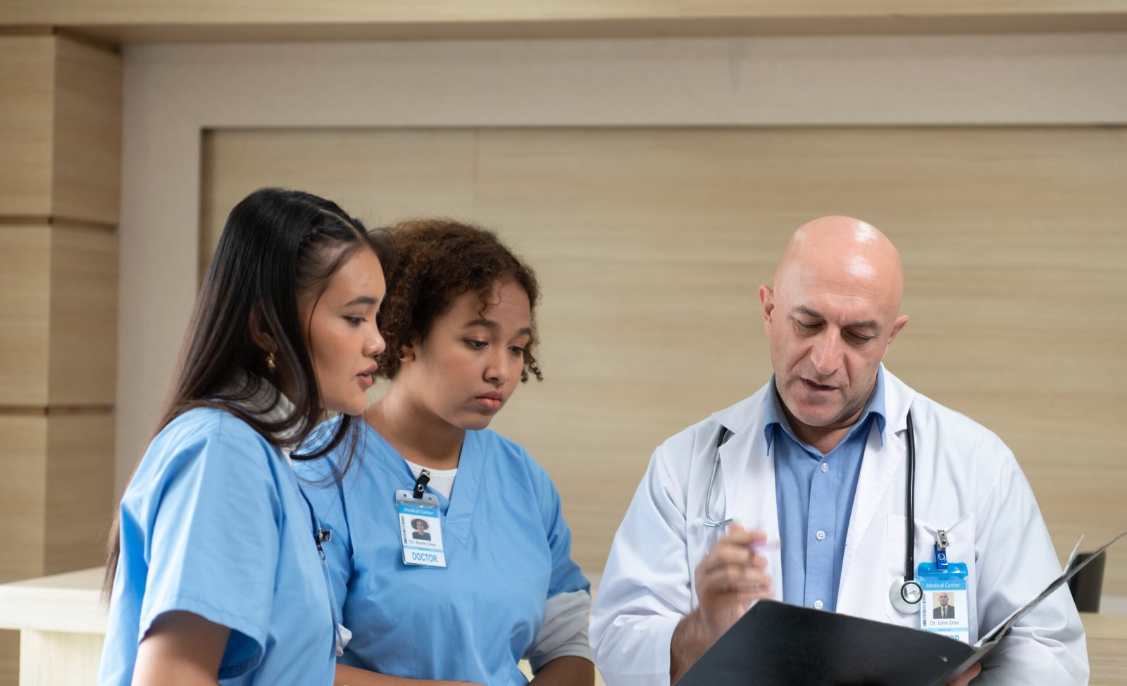 A medical professor gives advice on patient examinations to medi